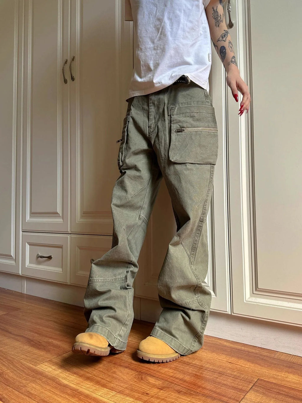 Green and black cotton casual workwear pants with double zipper front closure and multiple pockets