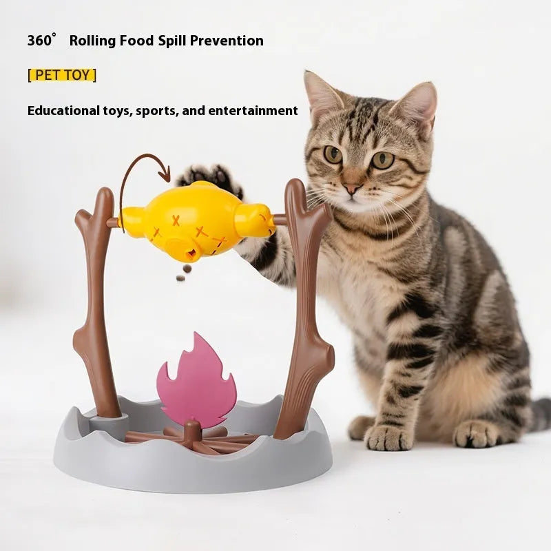 Barbecue-style plastic tumbling cat feeder toy for dispensing freeze-dried treats.