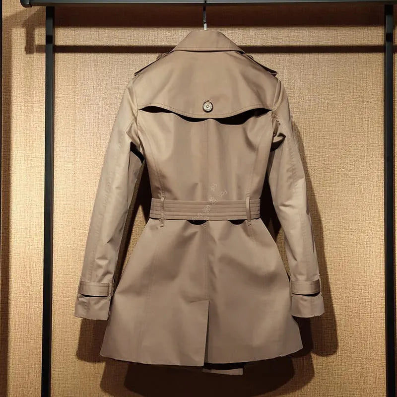 Women's khaki British double-breasted trench coat with flight sleeves on hanger