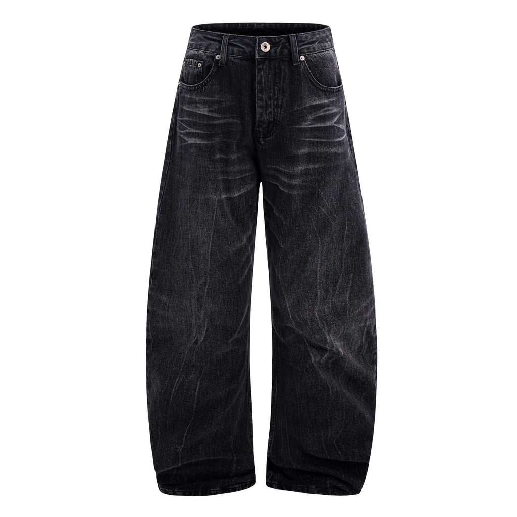 Black men's straight-leg jeans showing a cracked, washed denim finish on a plain background.