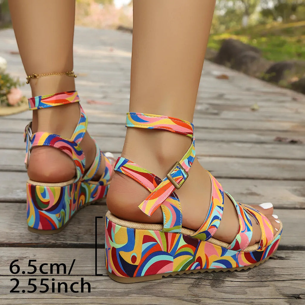 Women's buckle strap wedge sandals with fish mouth toe design in PU material.