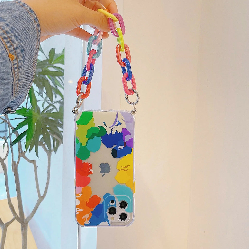 Clear TPU mobile phone case with printed graffiti design and integrated wrist strap attachment for iPhone