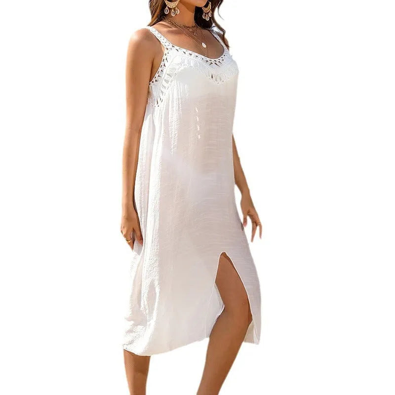 White women's beach dress with adjustable suspenders and hollow crochet detail