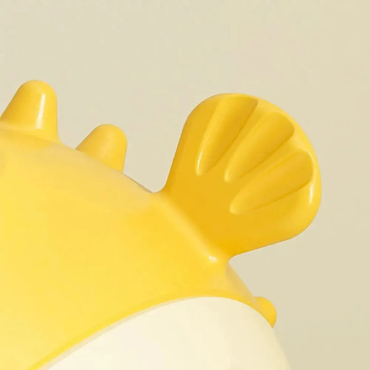 Yellow fish-shaped vinyl dog chew toy for aggressive chewers with textured surface