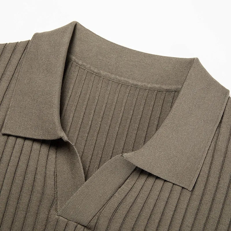 Man wearing a black and white striped mulberry silk T-shirt with a lapel collar.