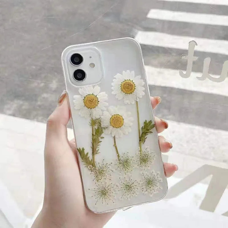 White TPU iPhone case with a raised epoxy daisy flower design on the back