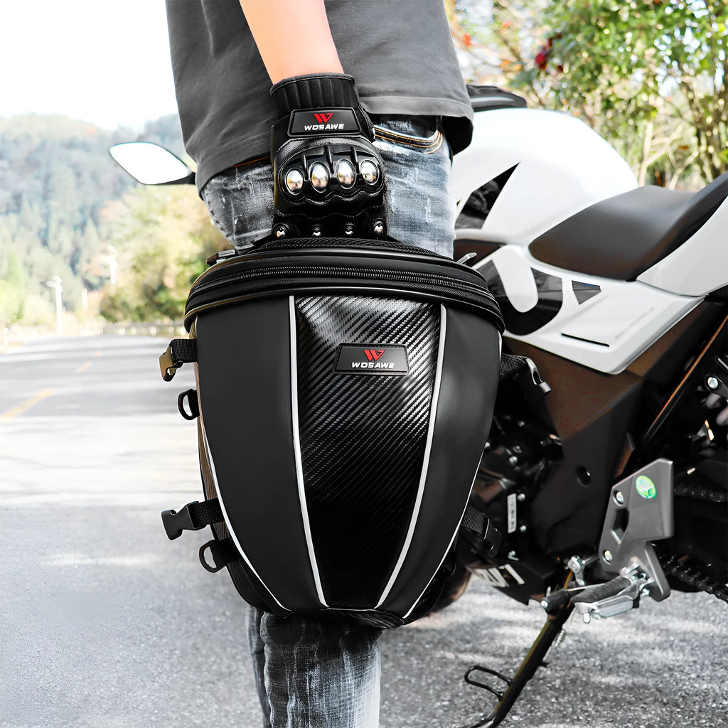 Black waterproof motorcycle seat bag with reflective strips, measuring 30x28x21cm with convertible crossbody strap