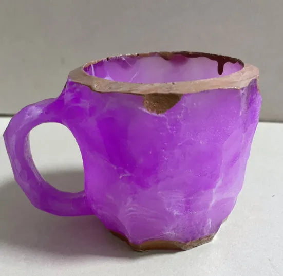Purple resin mineral crystal coffee mug with handle showing 3D texture and 10cm height
