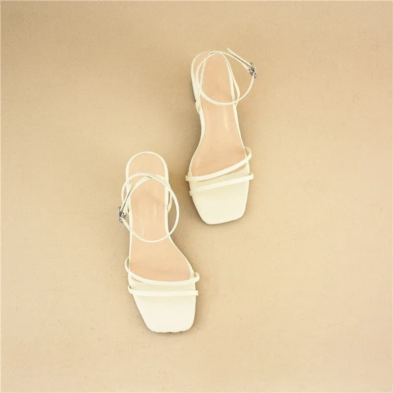 Beige women's sandals with a stiletto chunky heel, square toe, and a single ankle buckle.