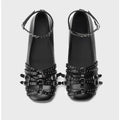 Women's black genuine leather retro pumps with buckle and low flat heel.