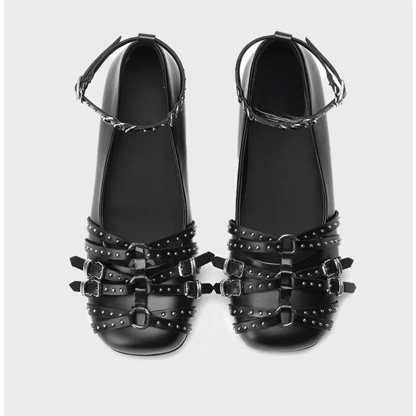Women's black genuine leather retro pumps with buckle and low flat heel.