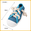 Yellow plastic dog slipper chew toy with a self-hi sound feature for biting.
