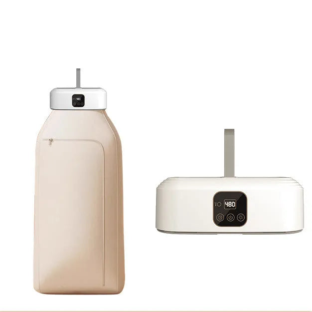 White cylindrical foldable portable clothes dryer with remote control on wooden surface