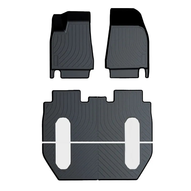 Custom rubber floor mats for Tesla cars, showing TPE footrest section and model-specific contours.