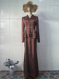 Dark brown retro floral print long sleeve women's dress with button details on a mannequin.