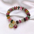 Handmade colourful tourmaline abacus bracelet with rabbit pendant charm on wrist