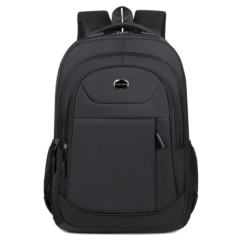 Black Oxford cloth multi-layer student backpack with curved shoulder straps, shown with compartments open.