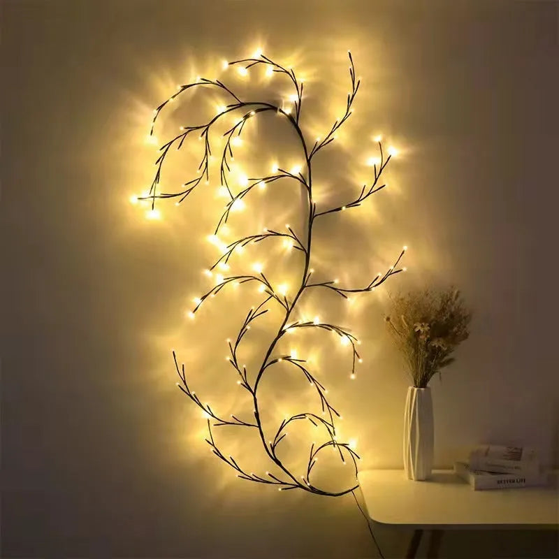 Flexible LED vine garland with birch bark texture and 144 warm white lights bent into decorative shape