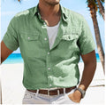 Men's grey loose fit long sleeve linen shirt with a polo collar on a plain background.