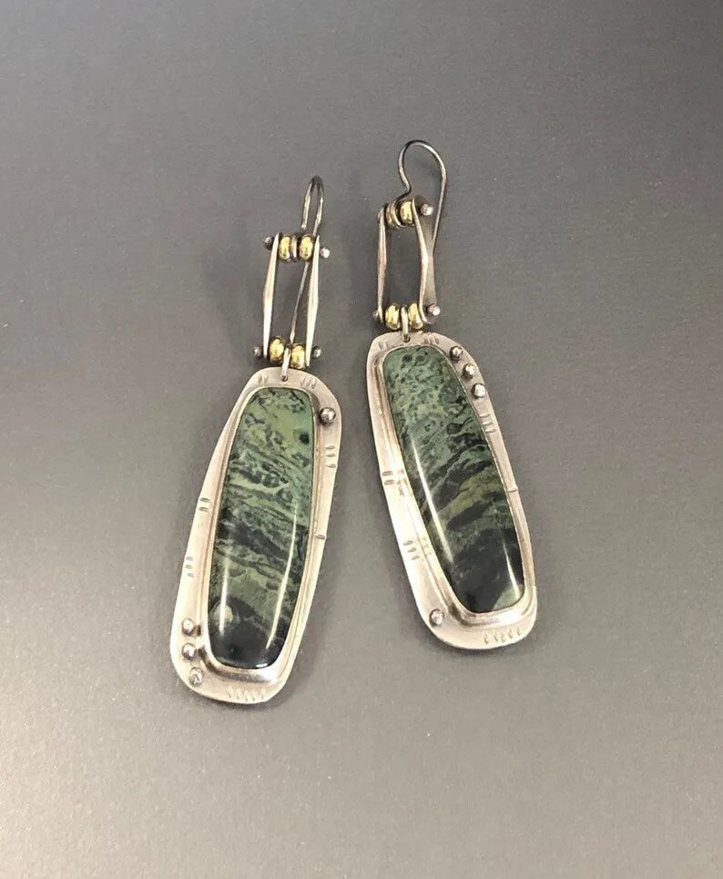 Geometric two-tone marble pattern alloy earrings with simple modern design