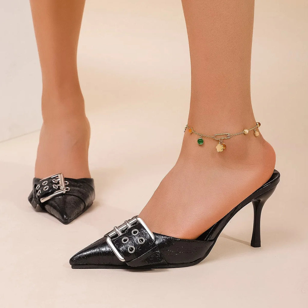 Black women's high heel shoes with pointed toe, ankle strap, and buckle decoration