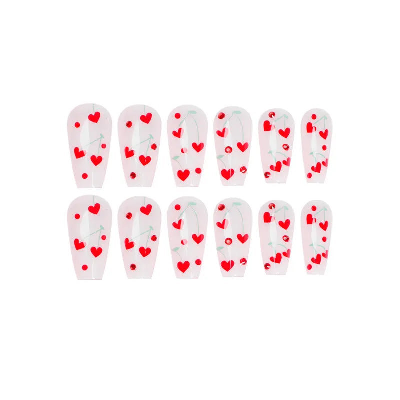 French-style red diamond and small cherry design nail art armour sheets and glue tube.