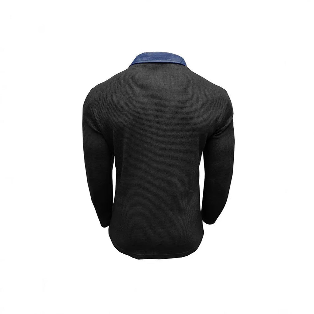A man wearing a long-sleeved waffle knit polo shirt in a solid colour with a loose, retro fit.