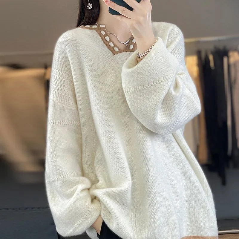 Women's camel-coloured V-neck long sleeve viscose sweater laid flat.