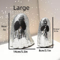 Silver Halloween ghost decoration with mosaic mirror patches for desktop display