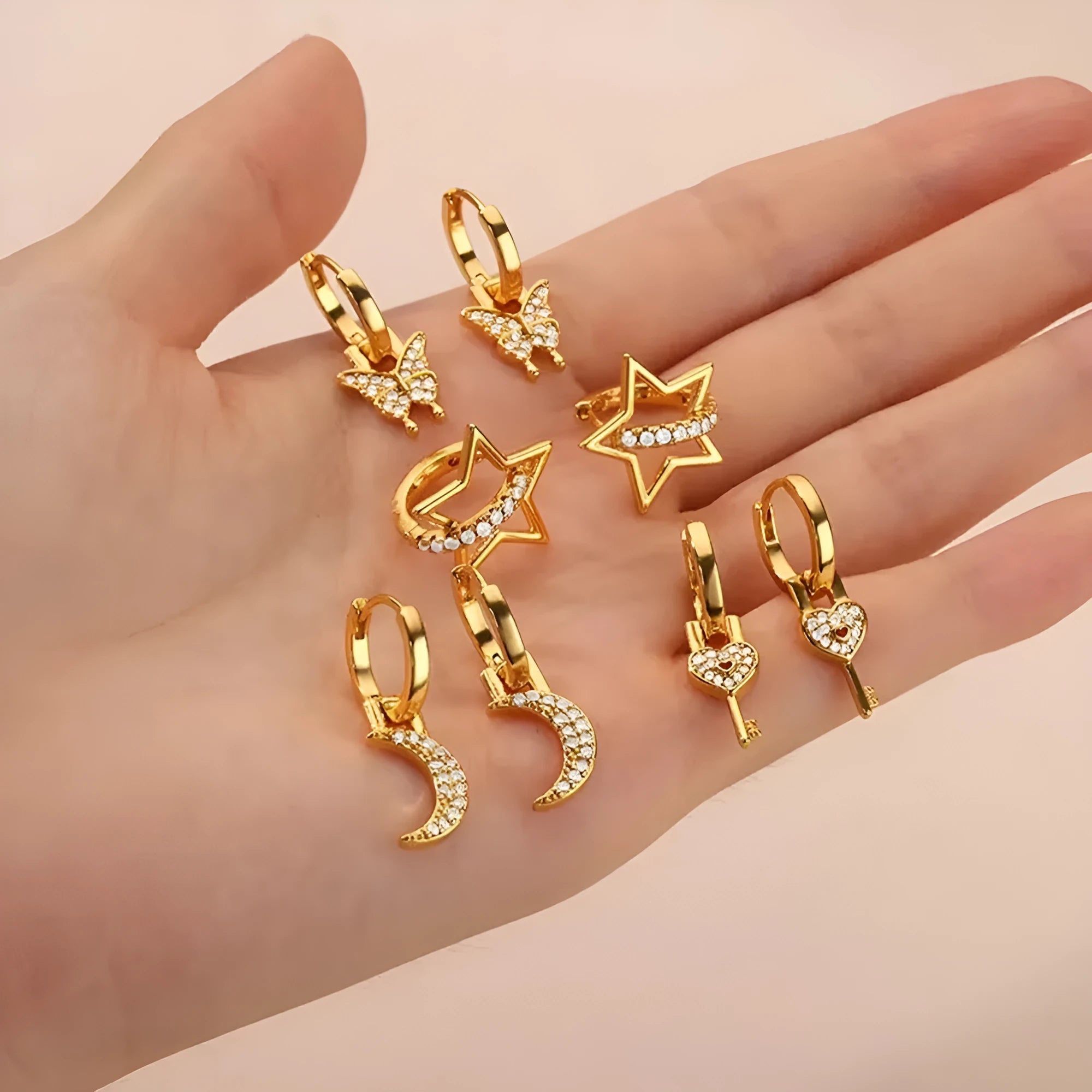 Geometric butterfly earrings with heart and star shapes in copper with diamond treatment