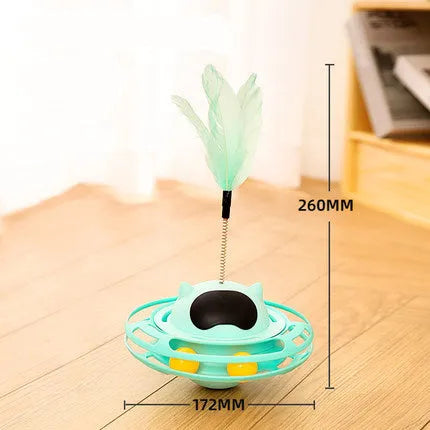 Pink cat tumbler turntable toy with interactive play stick on a flat surface.