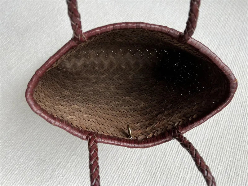 Brown woven leather tote bag with three-dimensional pocket and shoulder strap