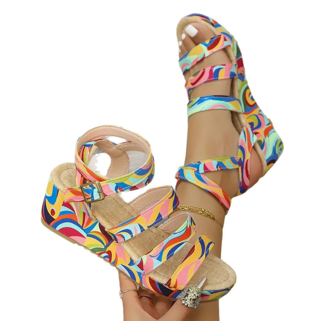 Women's buckle strap wedge sandals with fish mouth toe design in PU material.