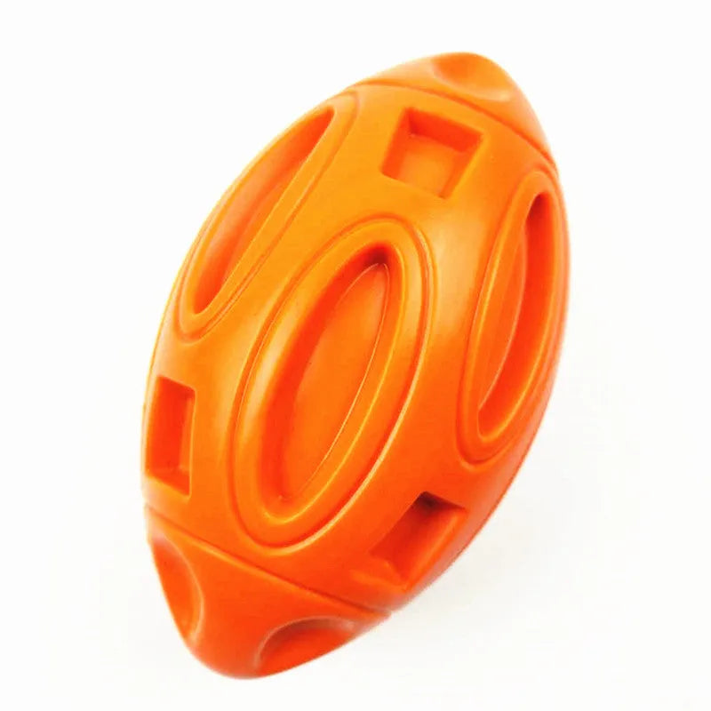 Durable natural rubber squeaky chew ball dog toy with surface grooves for medium and large breeds