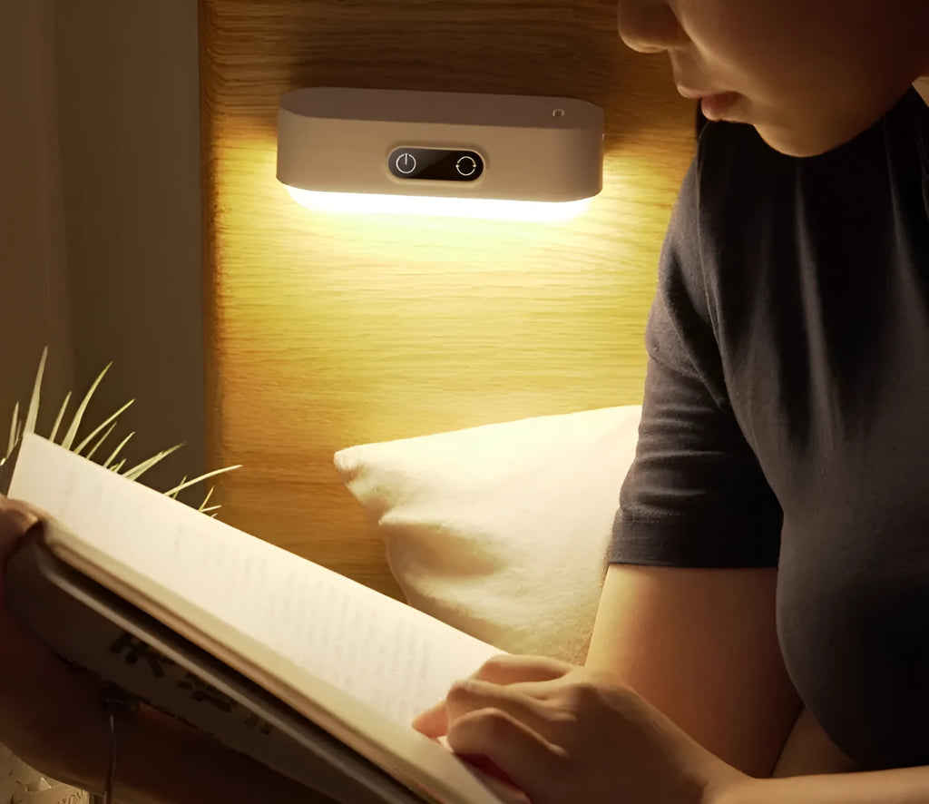 White USB rechargeable magnetic LED night light with touch controls on a metal study cabinet.