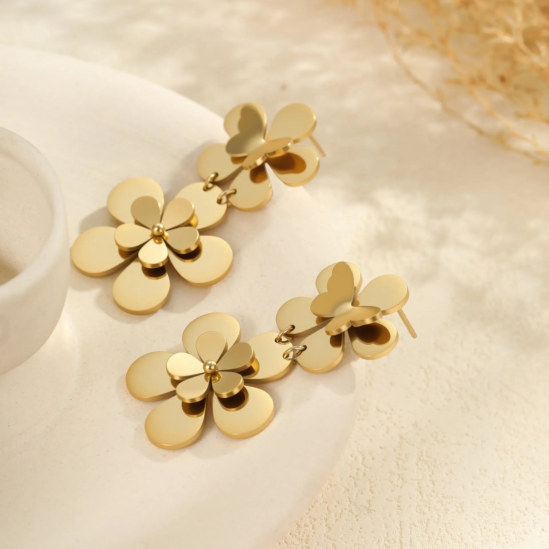 Gold-coloured stainless steel butterfly flower earrings with geometric and zodiac design elements