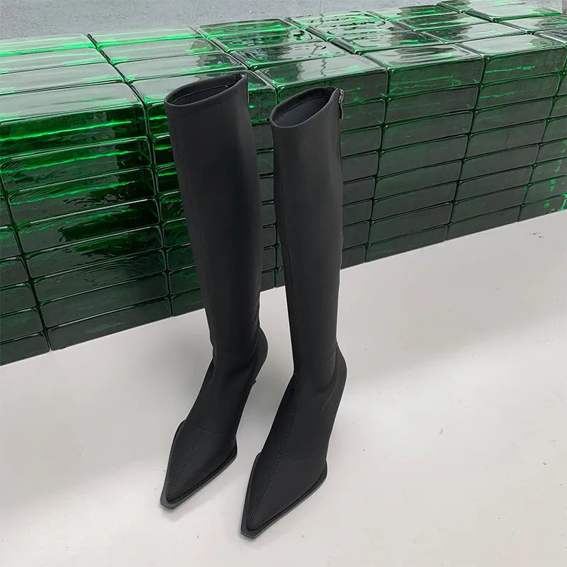 Black women's below-the-knee boots with a pointed toe, stiletto heel, and back zipper.