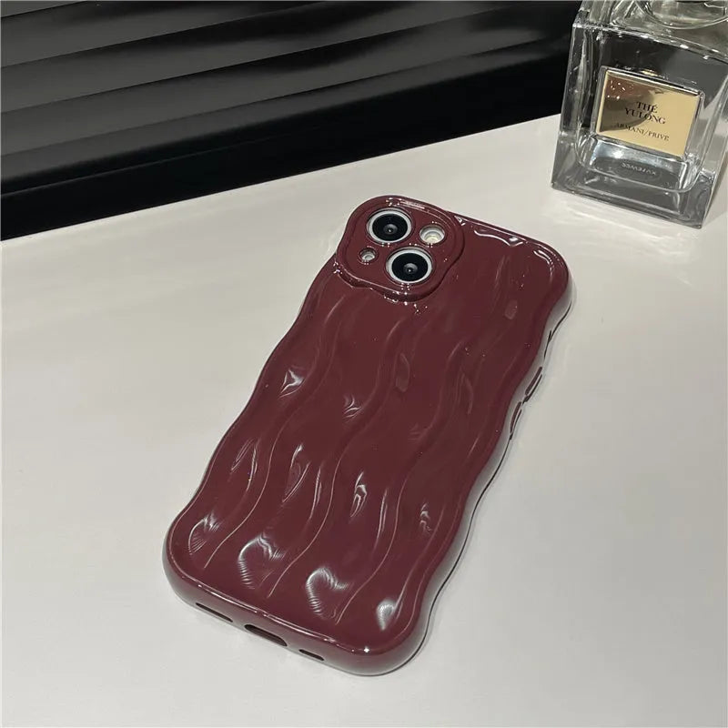 Soft silicone iPhone 17 phone case with water ripple pattern in beige, burgundy, green, silver, or purple colour.