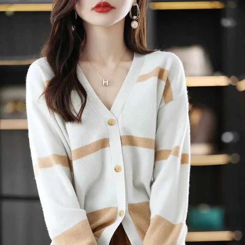 Women's striped V-neck knitted cardigan buttoned up, showcasing its slim fit and 3D pattern texture.
