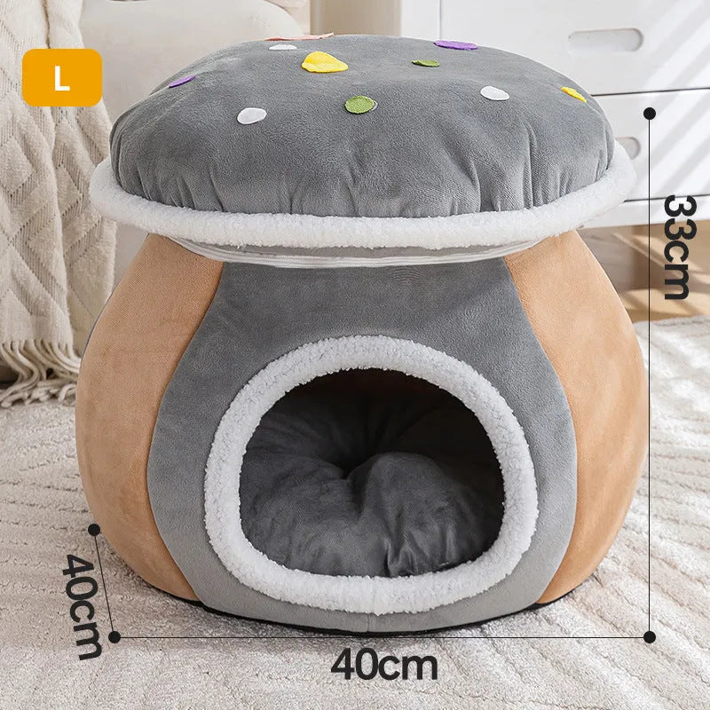Grey mushroom-shaped plush cat bed with an entrance hole, shown on a wooden floor.