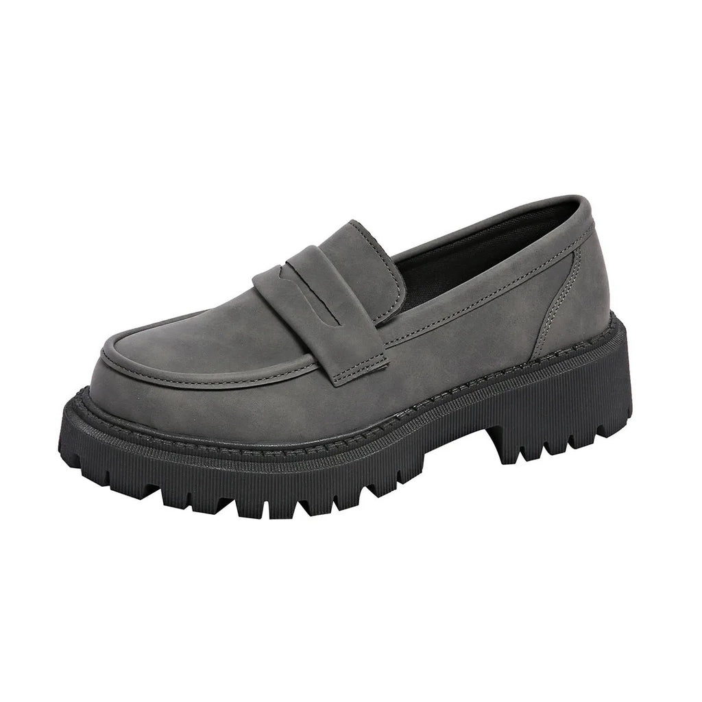 Gray British style slip-on low cut loafers with low heel and rubber sole