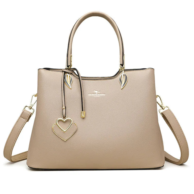 Women's black PU leather shoulder messenger bag with visible stitching and multi-layer interior.
