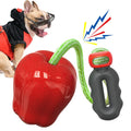 Green apple-shaped plastic dog toy with dropping ball design for molar exercise and interactive play