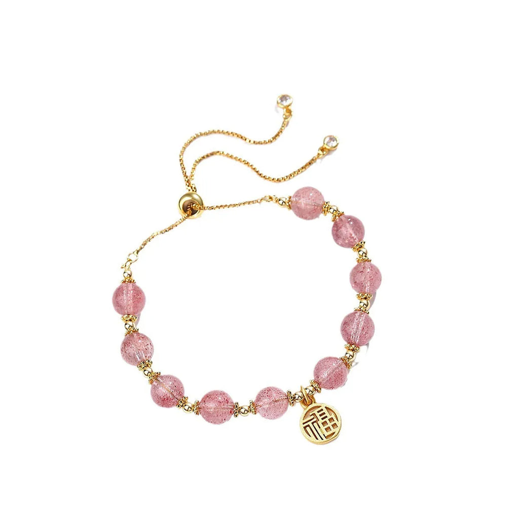 Women's strawberry quartz crystal bracelet with geometric design and fu character element