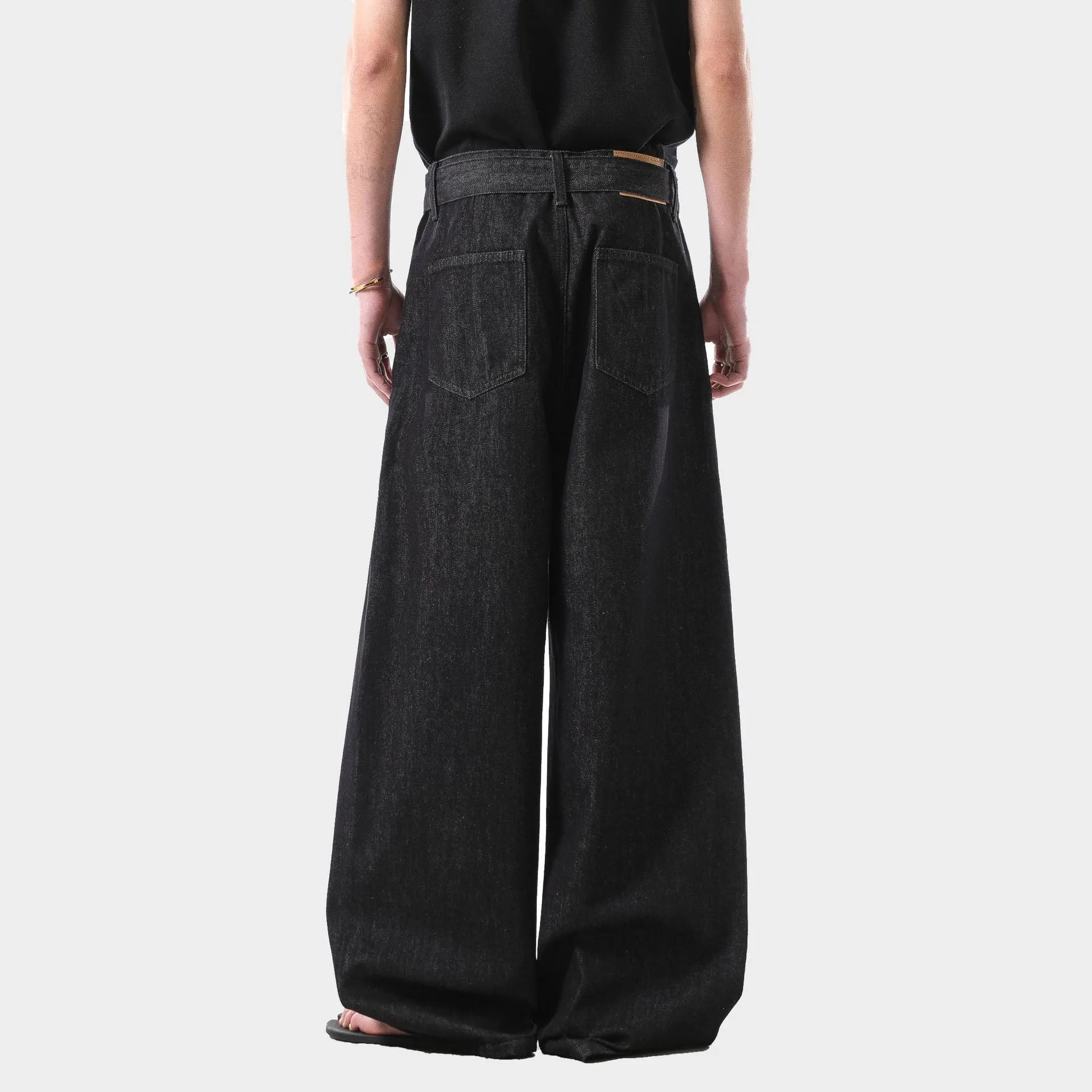 Black women's straight leg jeans with high waist and gold stitching detail