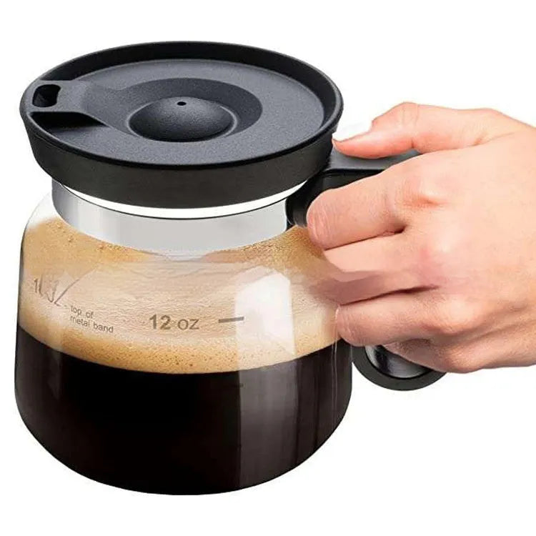Transparent borosilicate glass coffee maker with removable silicone cover showing modern simple design