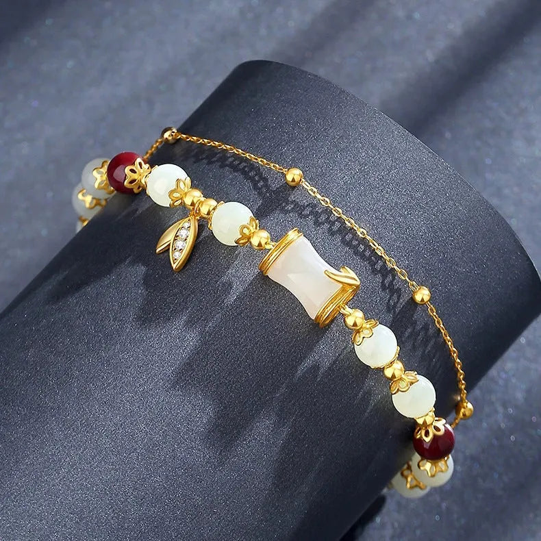 Retro style Ruyi floral bracelet made from coloured glaze and glass in beige, green, light green, or white.