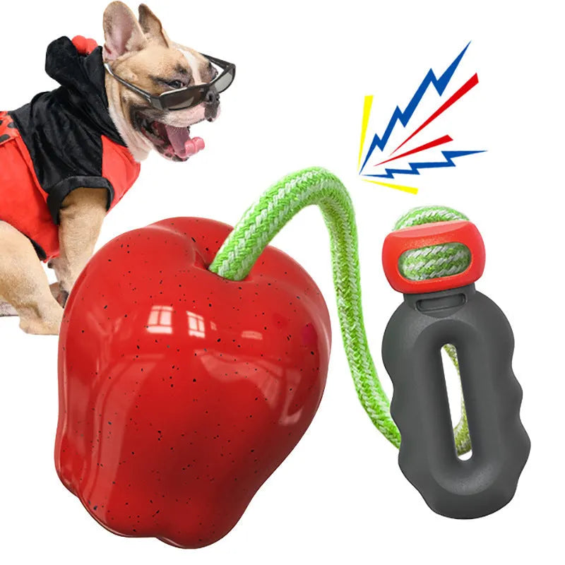 Green plastic dog toy shaped like an apple, functioning as a food-dropping ball and molar chew.
