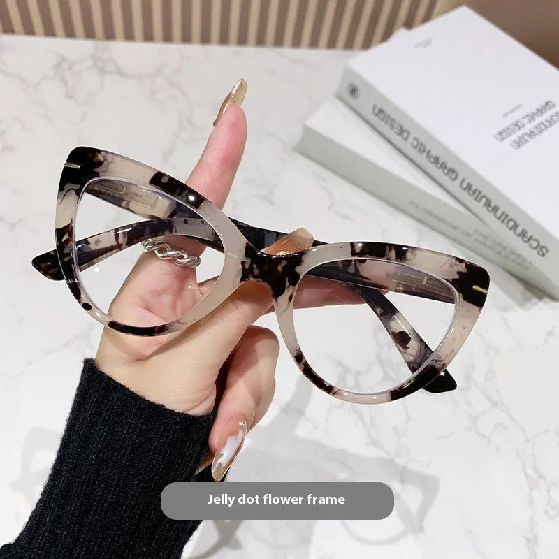 Women's large cat's eye frame glasses with dragon and phoenix decorations, shown in various colour options.