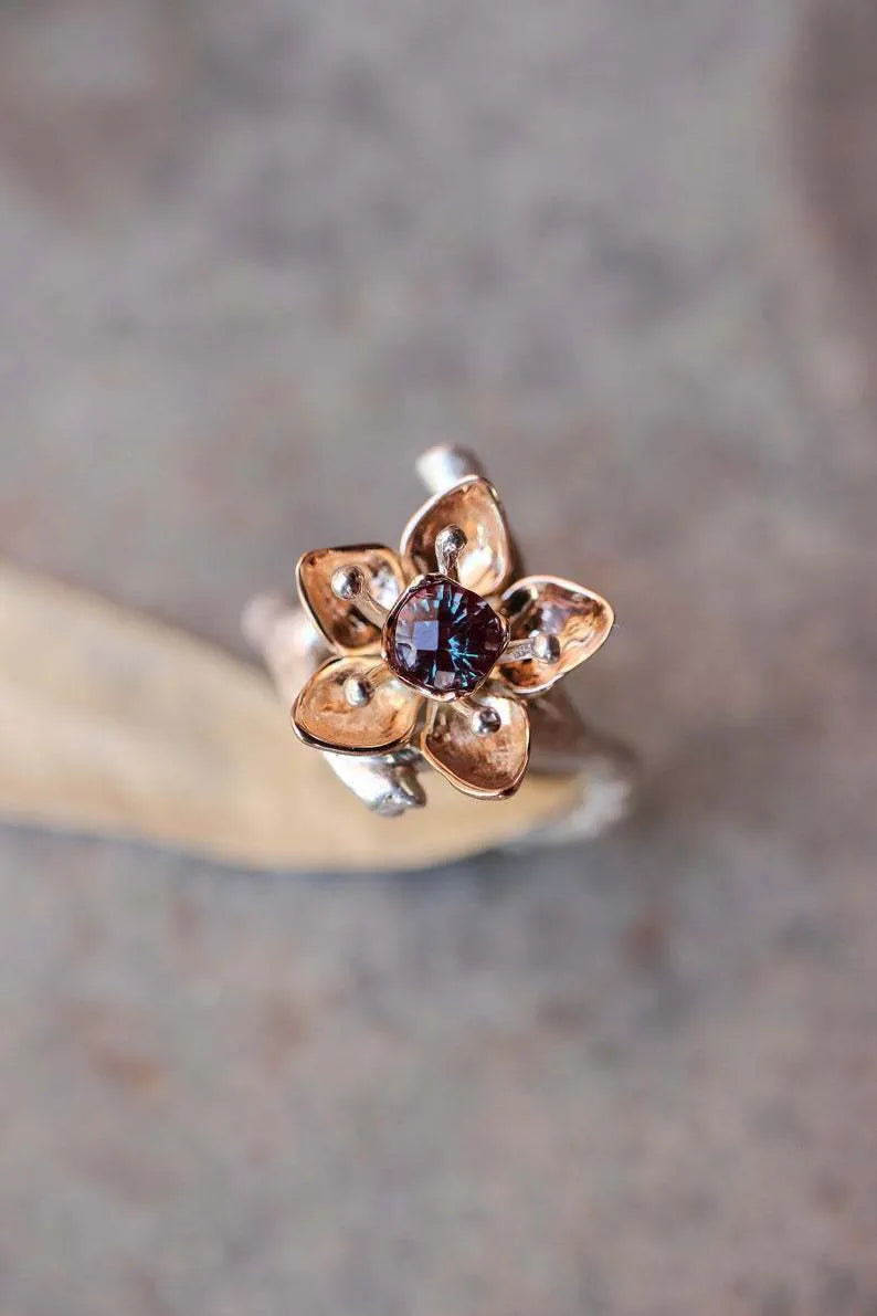 Silver two-tone floral geometric women's alloy ring on a plain background.
